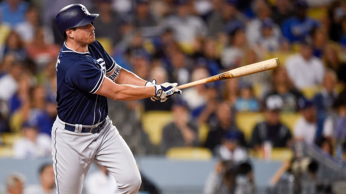The Padres' Hunter Renfroe hits an RBI double during the fifth inning of a baseball game against the Los Angeles Dodgers in Los Angeles, Monday, Sept. 25, 2017.