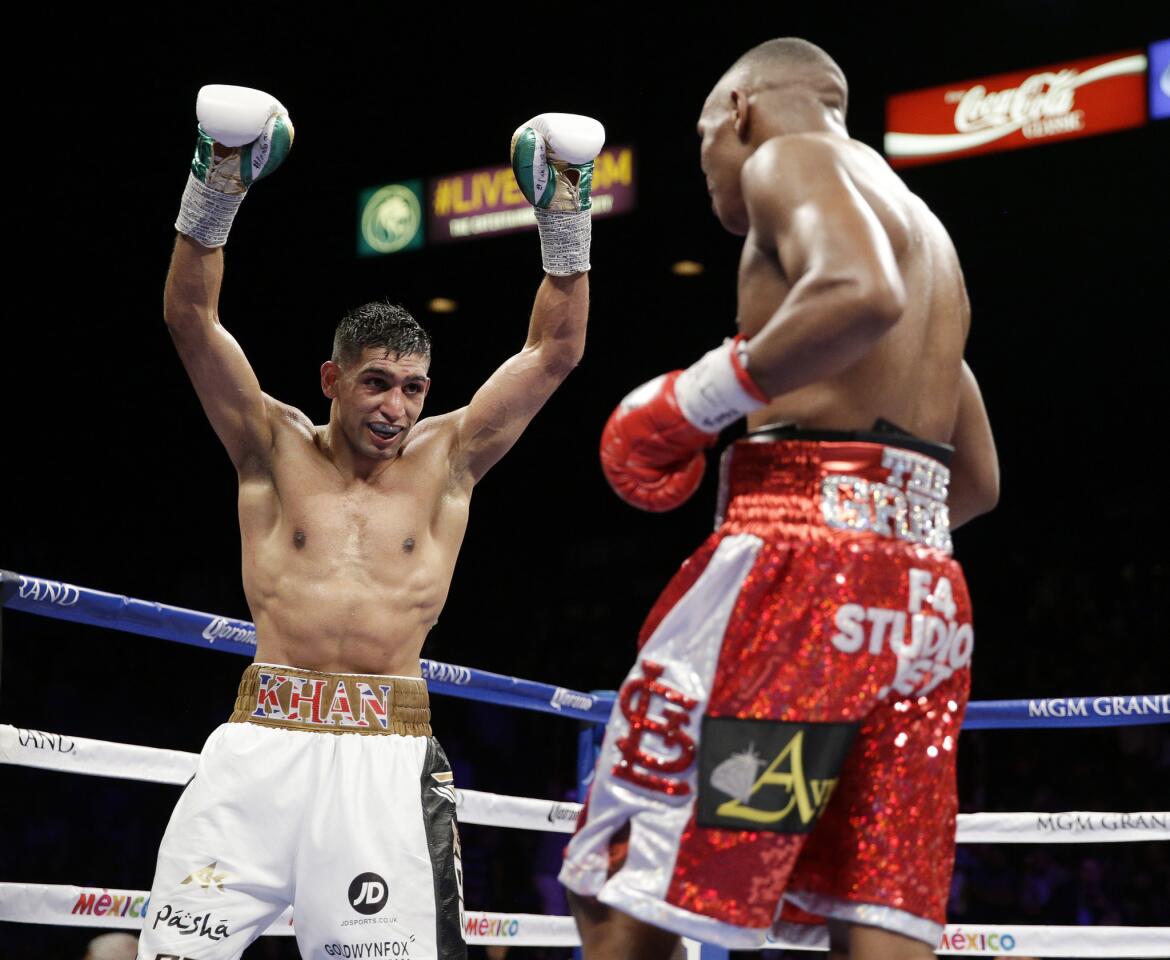 Amir Khan celebrates with seconds left against Devon Alexander during their welterweight bout Saturday in Las Vegas.