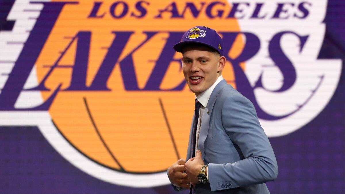Moritz Wagner walks across the stage at the Barclays Center after the Lakers selected him with the 25th pick in the NBA draft on Thursday night.