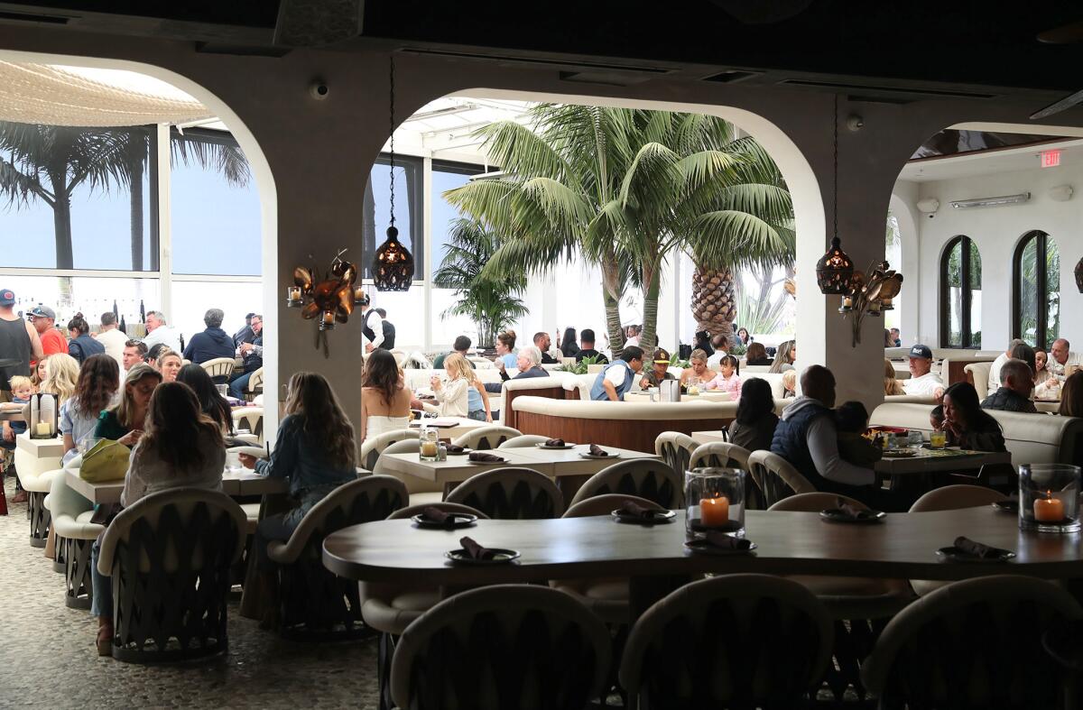 Guests enjoy the new dining and bar space at the remodeled Javier's in Newport Coast, Newport Beach.