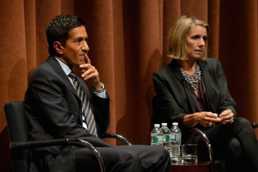 Dr. Sanjay Gupta, here with "Weed" collaborator Paige Figis, apologized this week for his previous stance against legalizing medical marijuana.