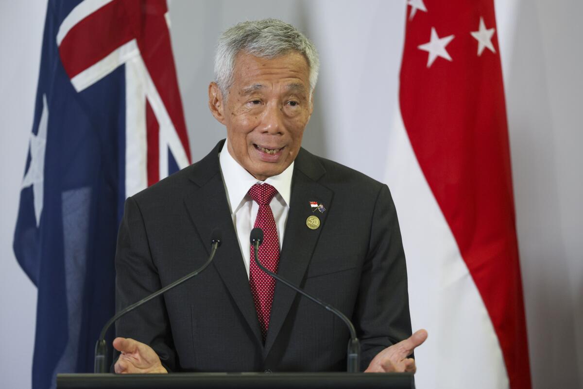Singapore Prime Minister Lee Hsien Loong speaking at a press conference