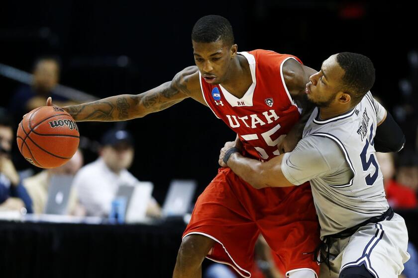 Utah's Delon Wright drives against Georgetown's Jabril Trawick during the Utes' 75-64 win Saturday.