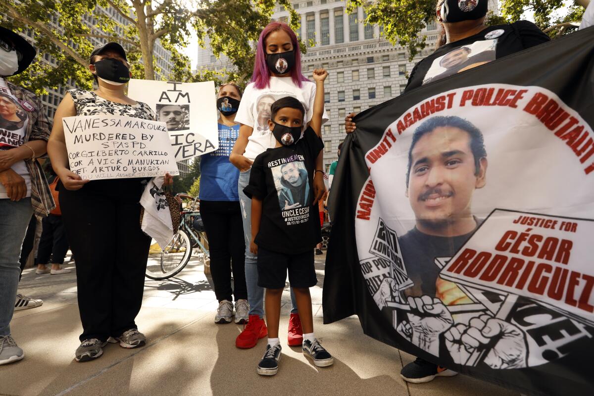 Isaiah Valdovinos raises his fist at a June 24 rally against police brutality. 