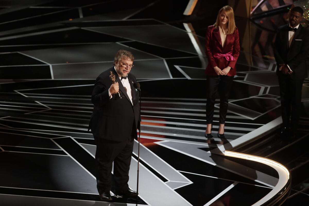 Guillermo del Toro accepting his Oscar for directing "The Shape of Water."
