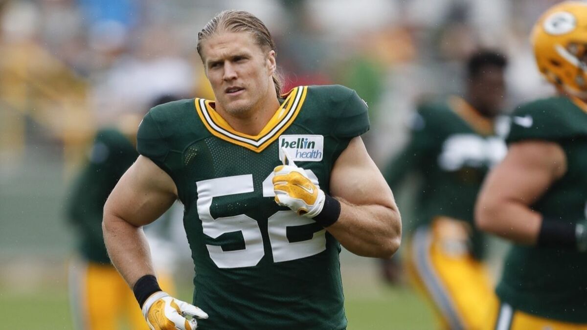 Clay Matthews jogs during a Green Bay Packers training camp session in July 2016.