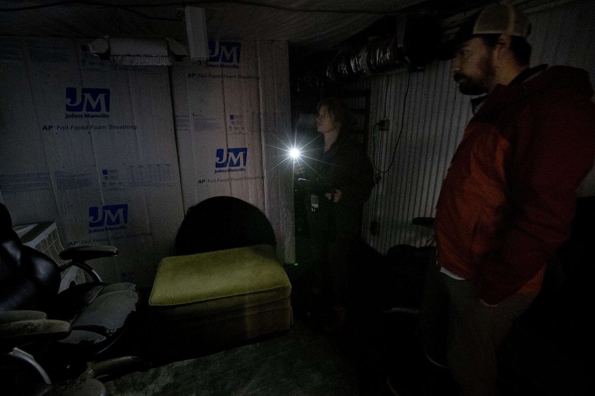 State inspectors look over a storage room.