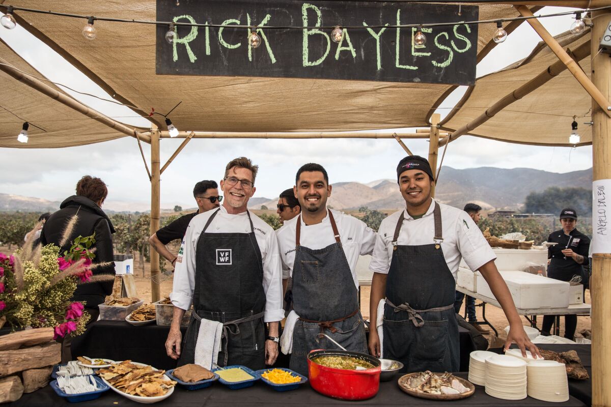 Famed American chef Rick Bayless, left, serves up food at the 2018 Valle Food & Wine Festival in Baja's Valle de Guadalupe.