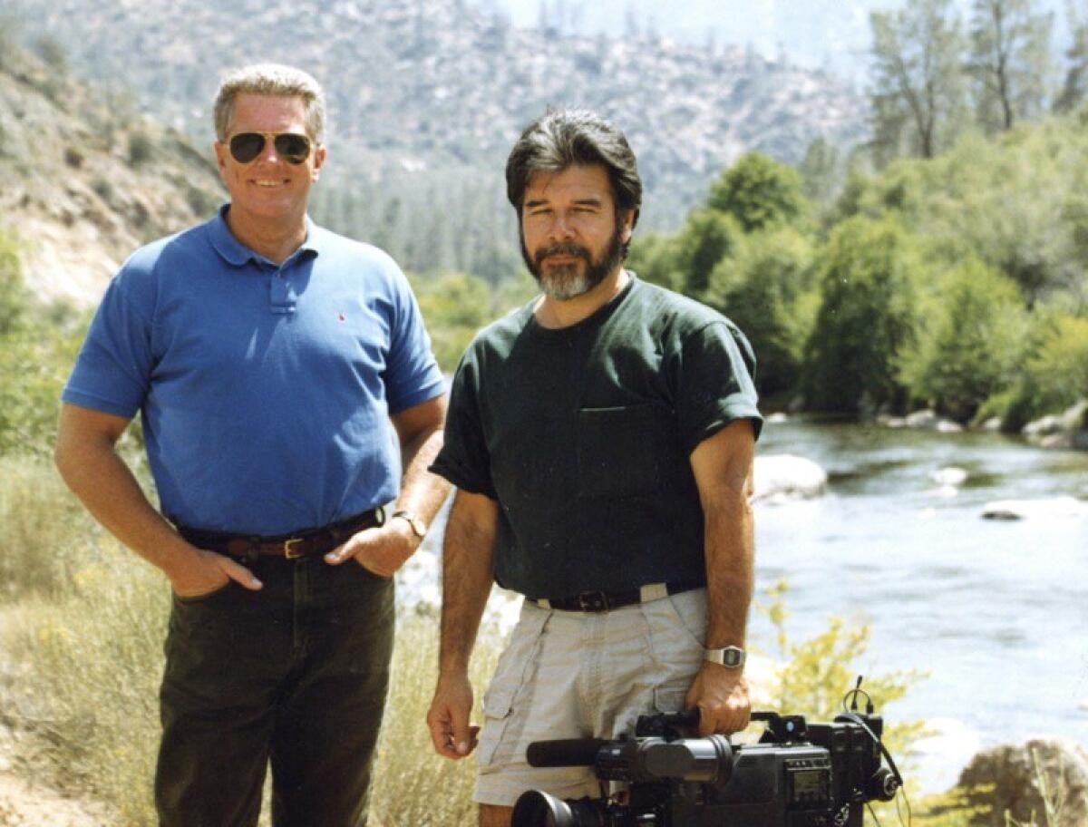 TV host Huell Howser, left, with cameraman Luis Fuerte in the early 1990s.