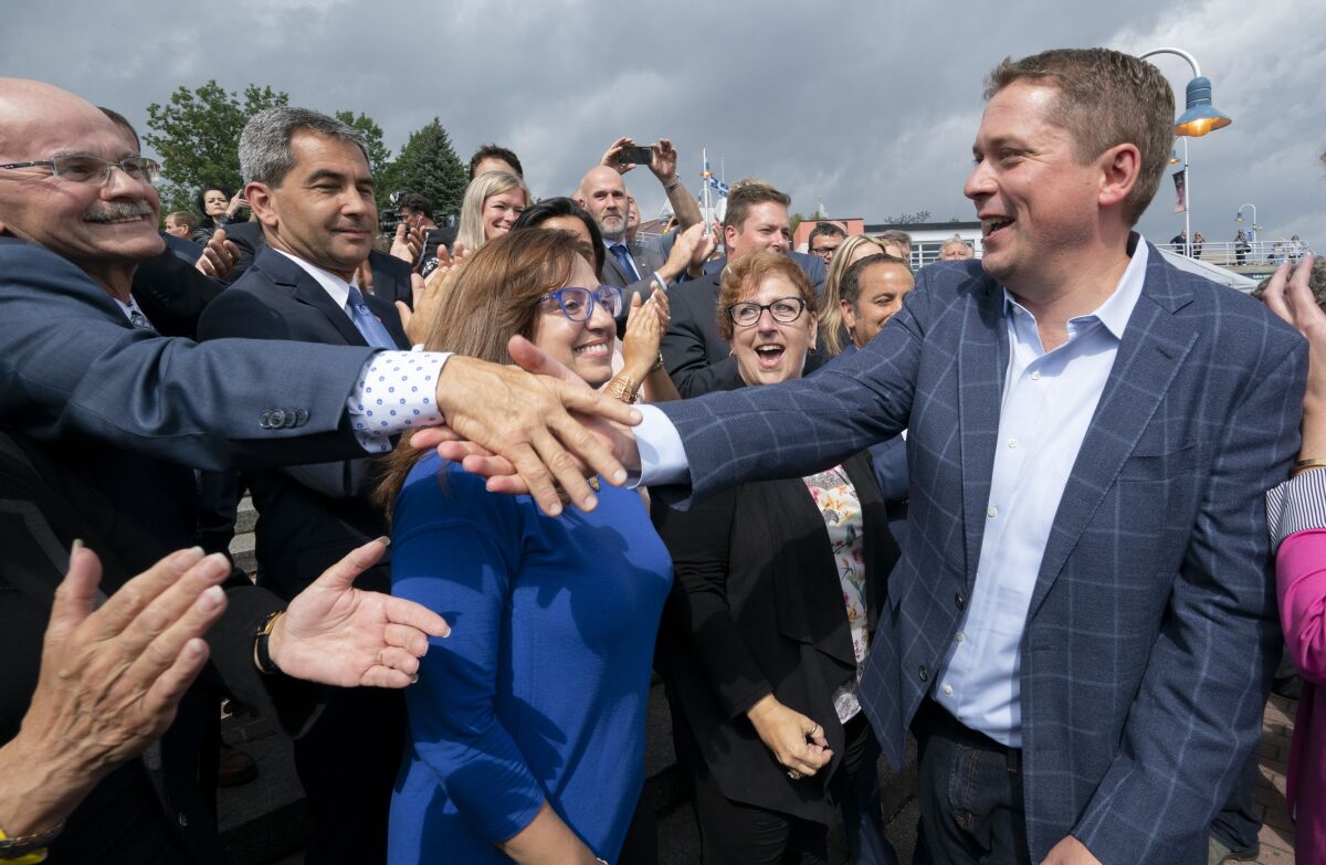 Canadian Conservative leader Andrew Scheer greets supporters during a campaign rally in Trois-Rivieres, Quebec, on Sept. 11, 2019.
