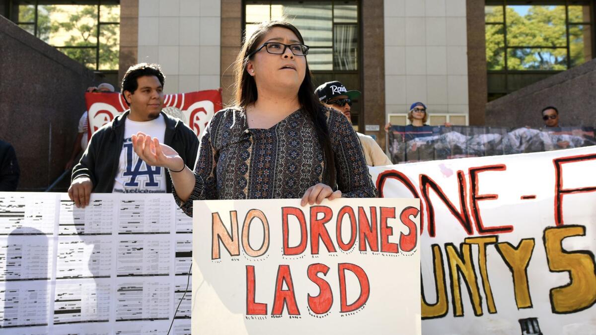 Vanessa Deleon speaks against the use of drones by the Los Angeles County Sheriff's Department during a news conference outside the Los Angeles County Hall of Administration.