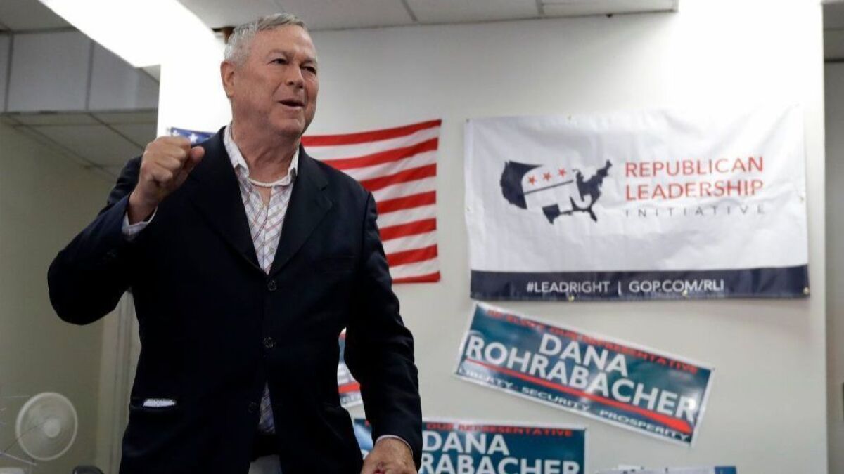 Rep. Dana Rohrabacher speaks to supporters at a GOP office in Laguna Niguel on Oct. 17.