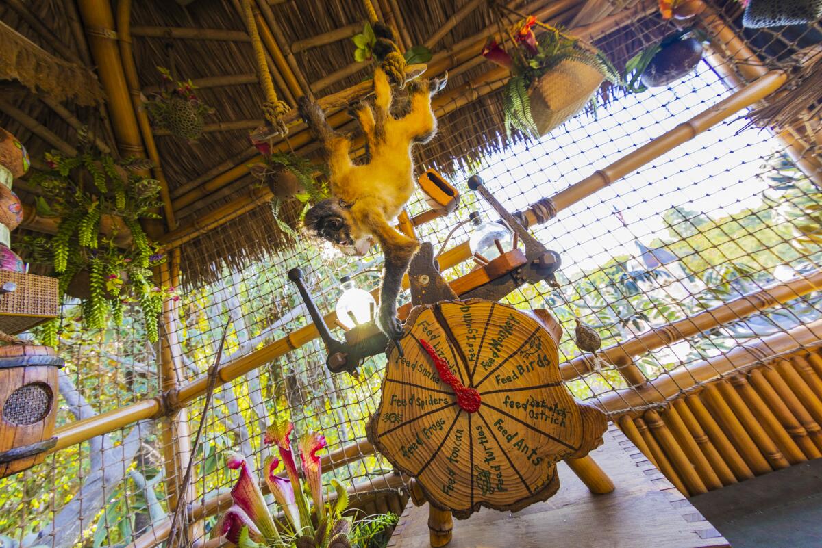 A mechanical monkey trying to control a food timer in the Adventureland Treehouse. 