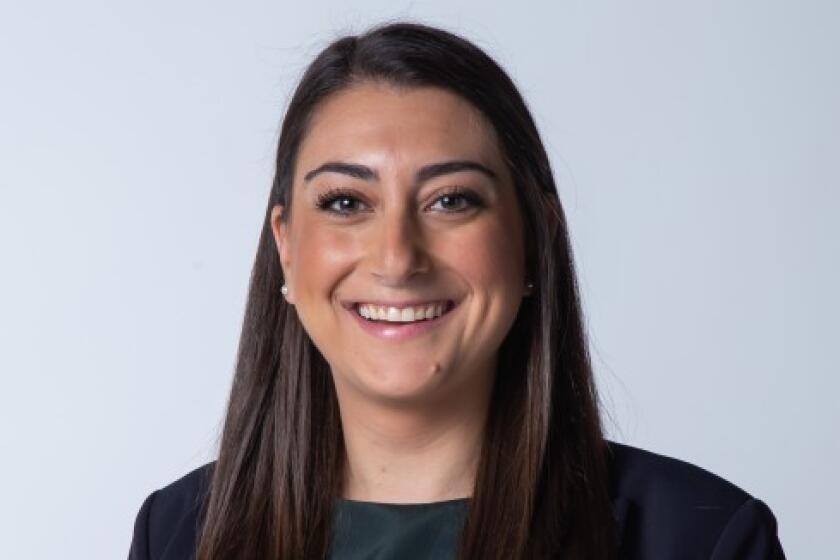 Congressional Candidate Sara Jacobs poses for a portrait in December 2019 .