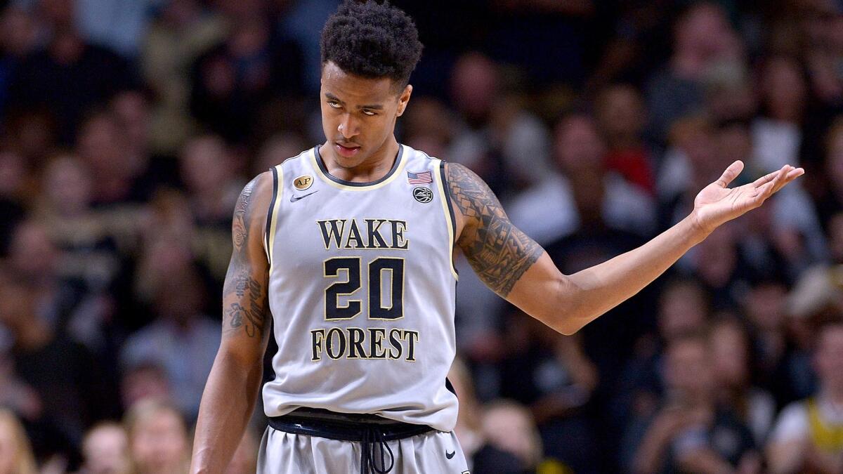 John Collins plays to the Wake Forest fans in the final seconds of an upset of Louisville on Wednesday night.