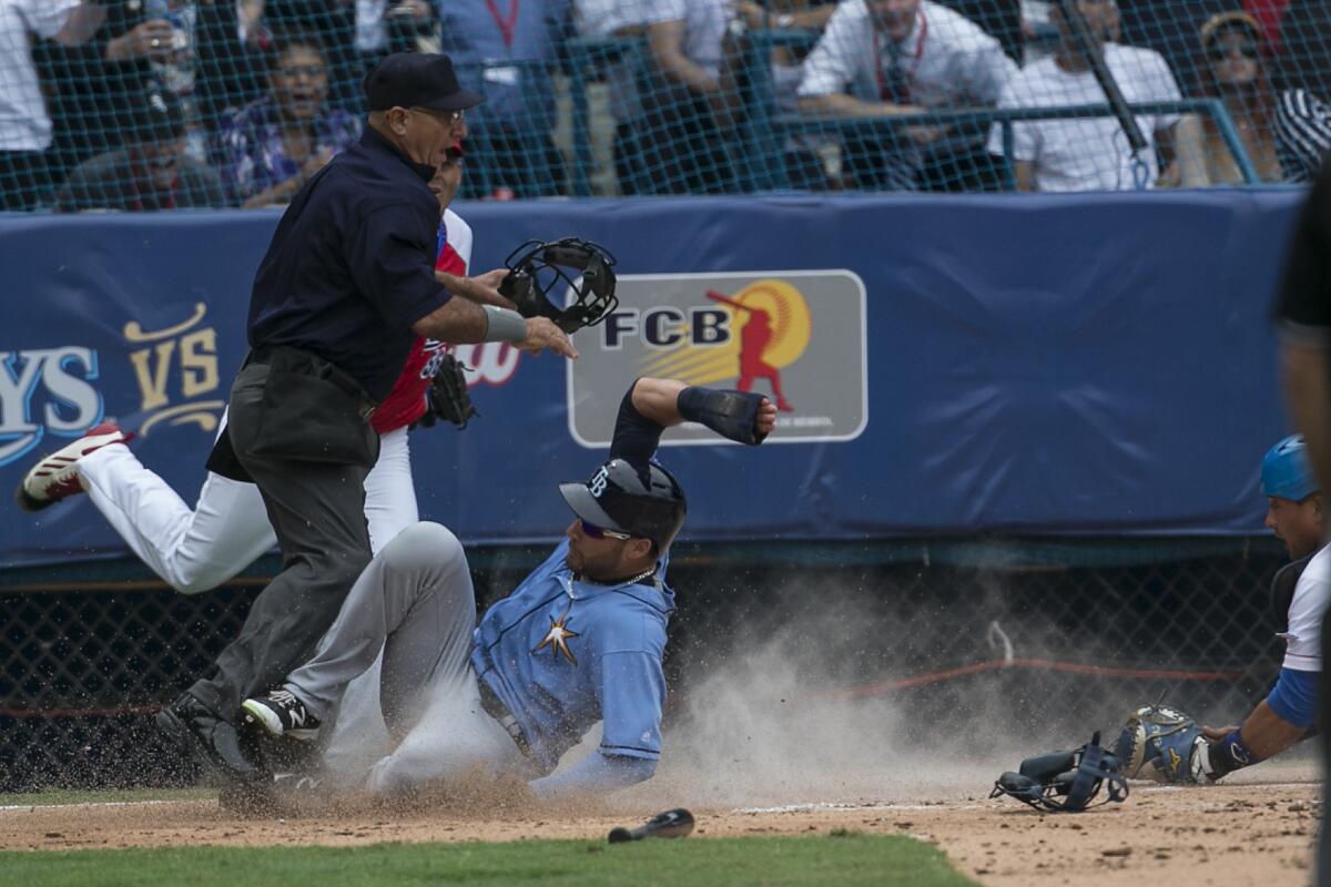 Tampa Bay Rays baserunner Kevin Kiermaier scores a run in the second inning to give Tampa a 1-0 lead over the Cuba National Team at Estadio Latinoamericano.