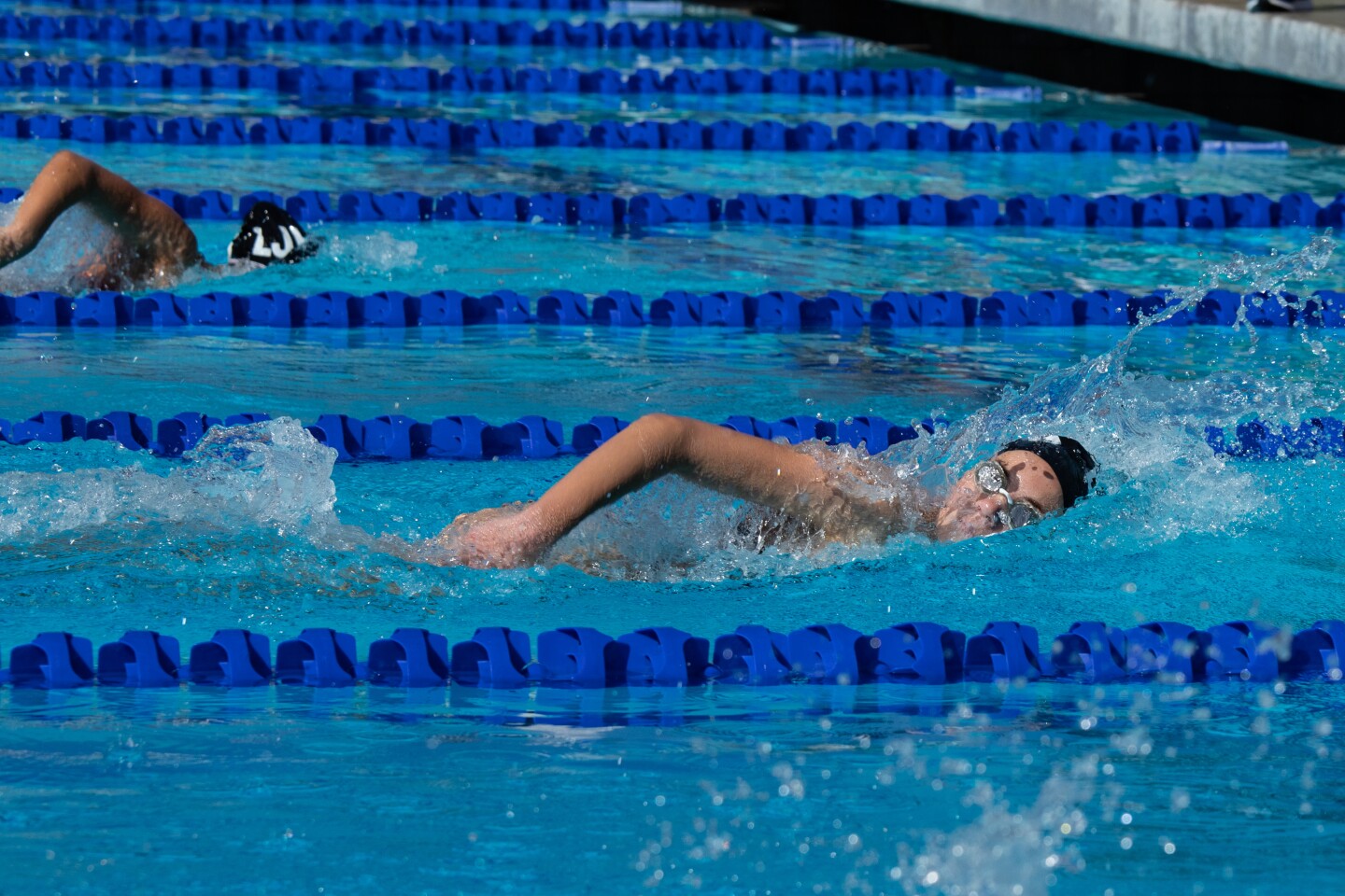 La Jolla High's Roxy Hazuka swims in the 100-meter freestyle March 20 against Academy of Our Lady of Peace of San Diego.