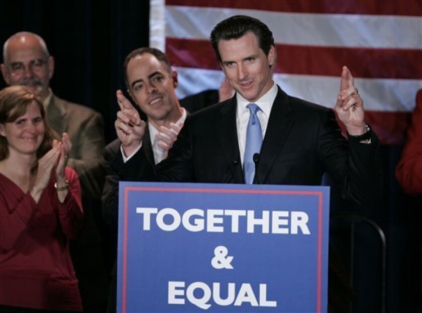 San Francisco Mayor Gavin Newsom crosses his fingers as he speaks at a rally against California Proposition 8 in San Francisco, Tuesday night, Nov. 4, 2008. Newsom campaigned to reject ballot measure Proposition 8 that would ban same-sex marriage in California. (AP Photo/Paul Sakuma)
