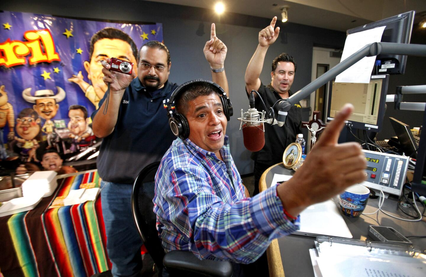 Ricardo "El Mandril" Sanchez, center, at the microphone at KLAX-FM (97.9) La Raza in Los Angeles. "I like him a lot. I've been around a lot of famous radio or TV folks, and some are more genuine than others," Mayor Eric Garcetti says. "He's as real as they get."