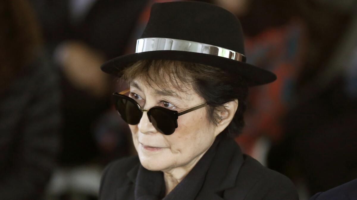 In a June 12, 2015, photo, artist Yoko Ono appears during a ceremony announcing the future installation of Ono's first permanent public art installation in the U.S., in Chicago.