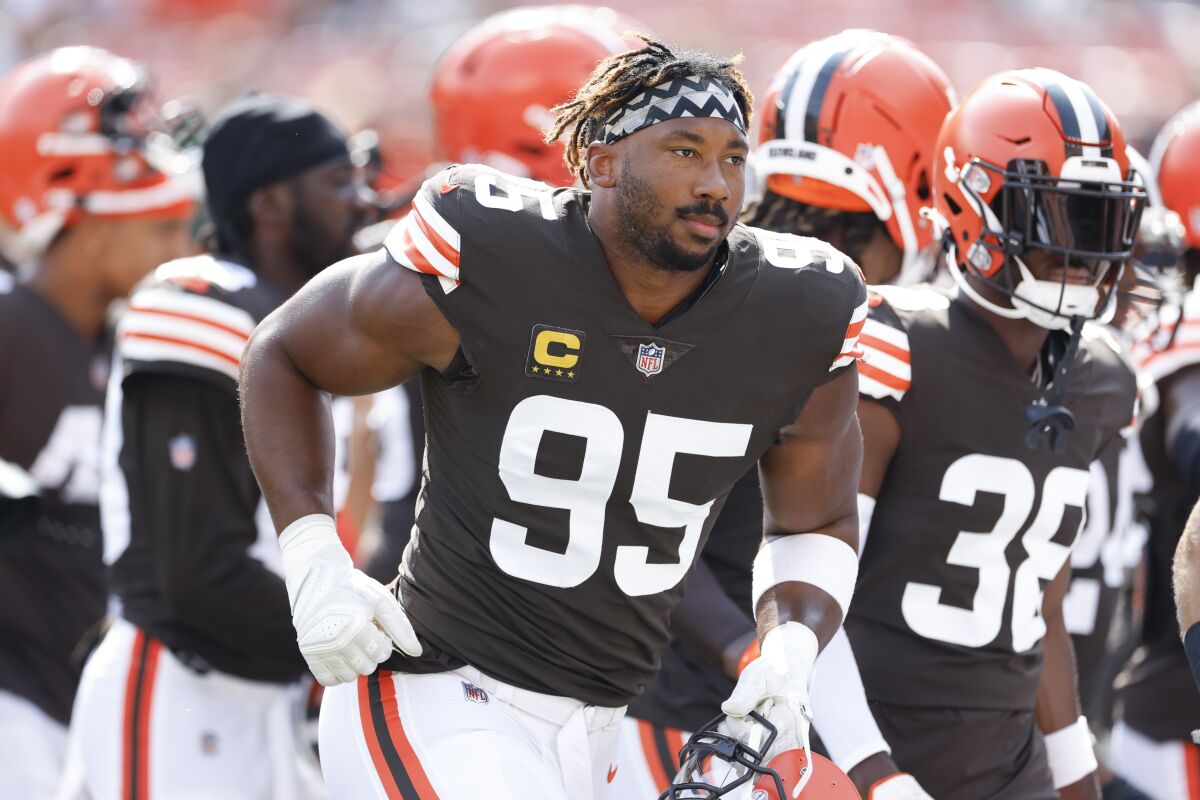 FILE - Cleveland Browns defensive end Myles Garrett (95) warms up before an NFL football game against the New York Jets on Sept. 18, 2022, in Cleveland. Garrett returned to practice Wednesday, Oct. 5, 2022, for the first time since being injured in a car accident last week, when he lost control of his Porsche while speeding. (AP Photo/Ron Schwane, File)