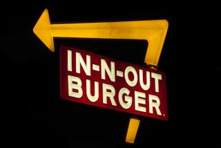 IN-N-OUT -- In-N-Out Burger sign in Camarillo, Calif., Saturday night, Aug. 20, 2005. -- Photo Credit: Robbin Goddard