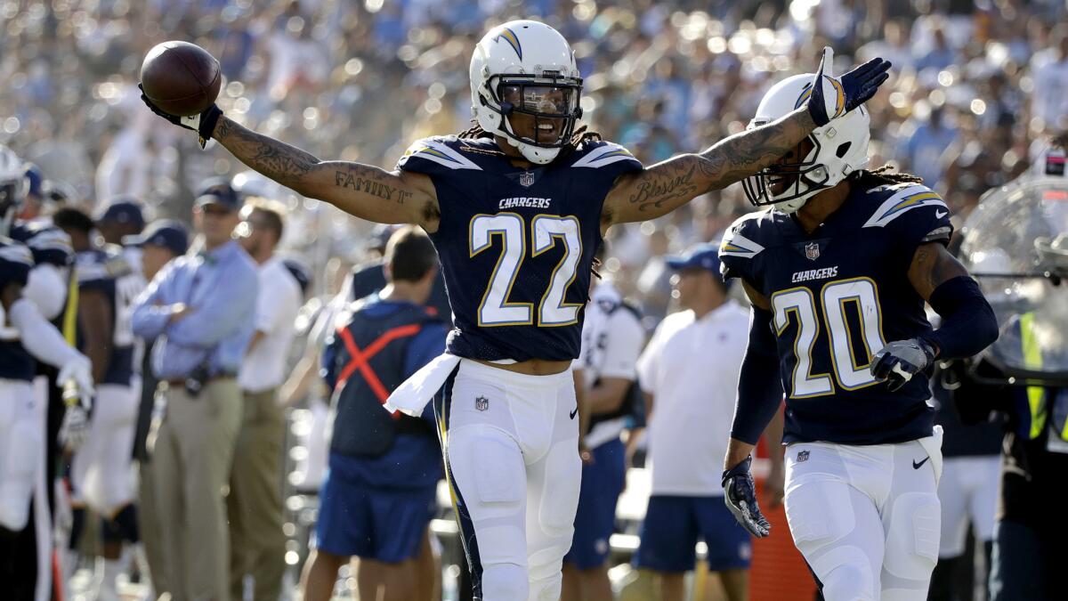 Chargers cornerback Jason Verrett celebrates after intercepting a pass by the Rams during the first half Saturday.