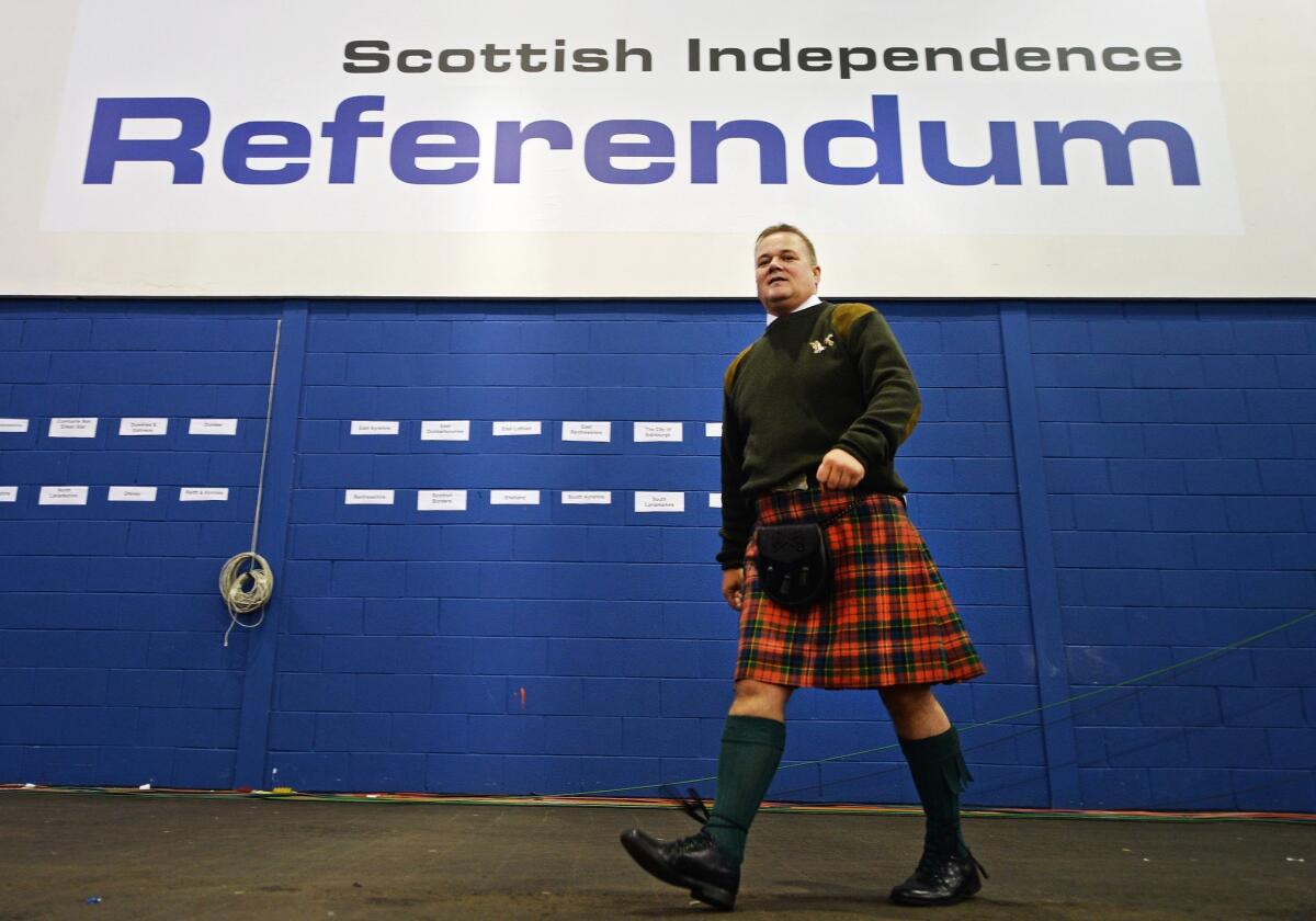 A Scotsman walks through the Royal Highland Center in Edinburgh during Scotland's independence referendum in September 2014.