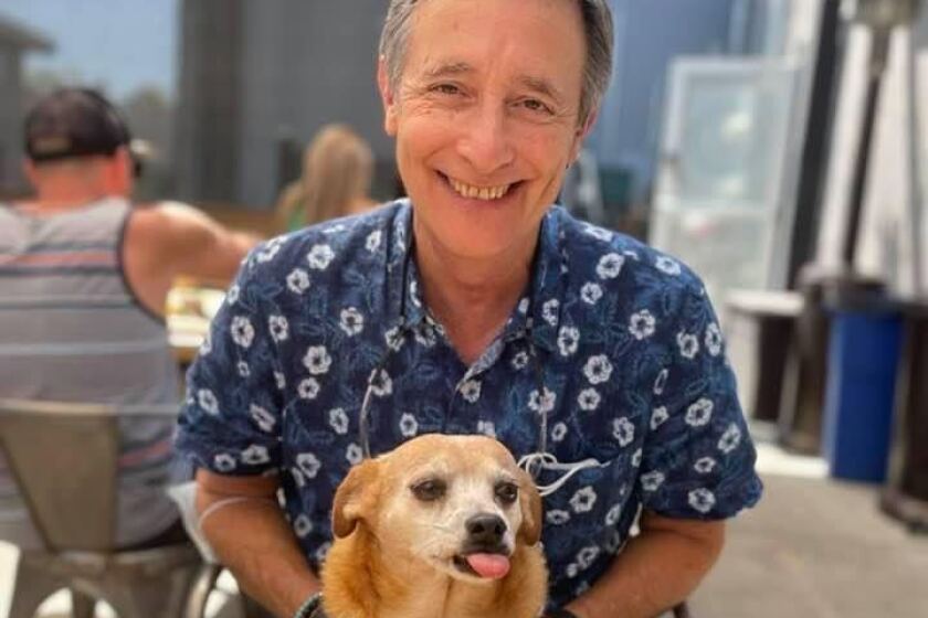 Point Loma resident Jack Abbott sits with his prized chiweenie, Lolabeth.