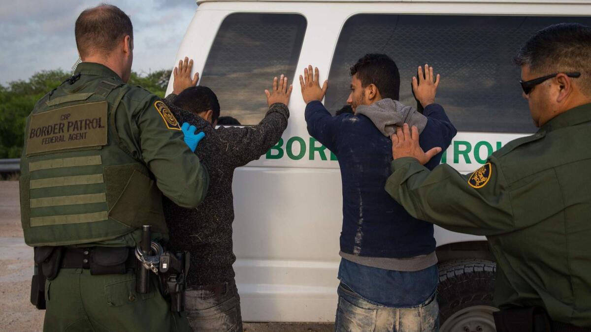Border Patrol agents arrest migrants who crossed into the U.S. from Mexico near McAllen, Texas, in March.