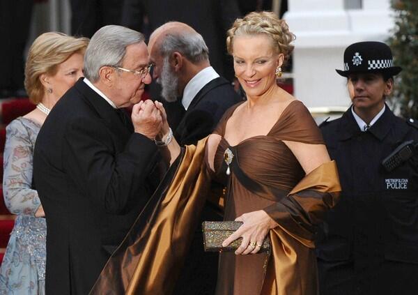 Greece's exiled King Constantine, left, kisses the hand of Princess Michael of Kent, the Baroness Marie Christine Agnes Hedwig Ida von Reibnitz.