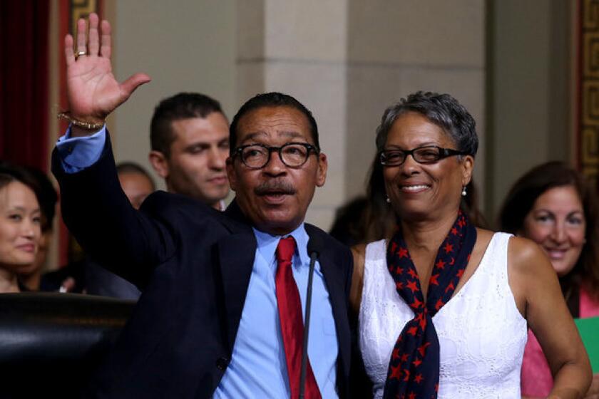 Herb Wesson with wife Fabian, acknowledges applause after being reelected president of the Los Angeles City Council.