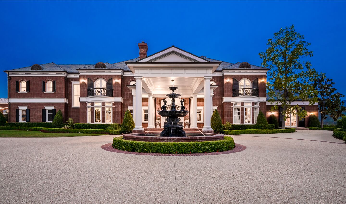 Sprawled across nearly seven acres, the compound includes a Colonial-style mansion, two guesthouses, a swimming pool and tennis court.