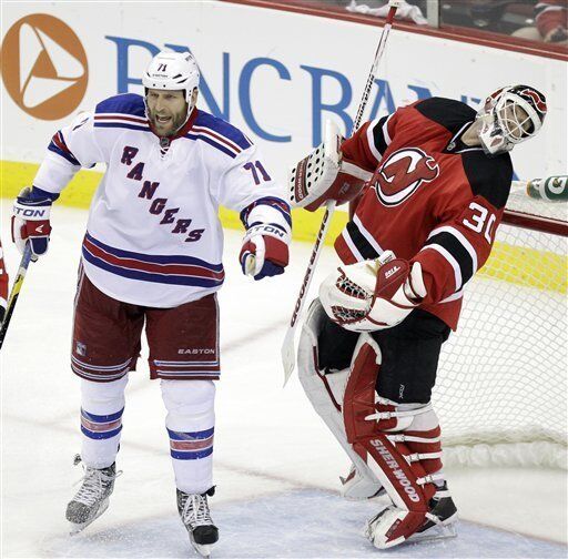 May 14, 2012: New York Rangers defenseman Stu Bickel (41) takes a shot at  New Jersey Devils center Ryan Carter (20) during game 1 of the Eastern  Conference Finals at Madison Square