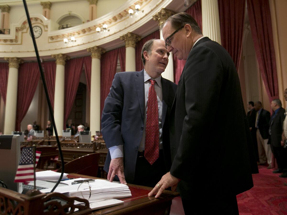 State Sen. Mark Wyland, R-Escondido, left, talks with Senate Minority Leader Bob Huff, R-Diamond Bar, during a recent floor session. Huff's proposal to audit the state's oversight of the Inglewood school district was blocked by Democrats.