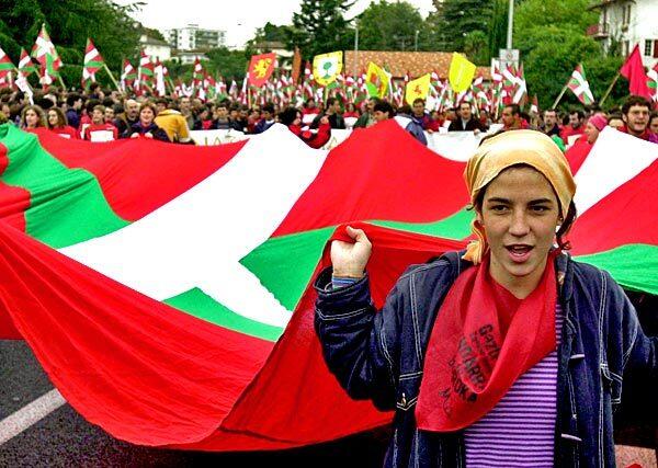 The Basques live in a region straddling the border of Spain and France. The Basque separatist group ETA, which is classified as a terrorist group by Spain, declared an end to violence in October. In this photo, protesters hold a Basque flag as they demonstrate in southwestern France in 2000 during a march by Basque nationalists to protest against a European Union summit.