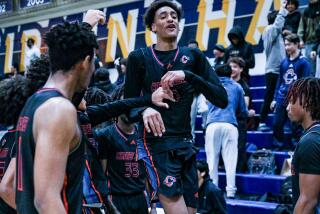 Alijah Arenas of Chatsworth celebrates after making a three with one second left in regulation