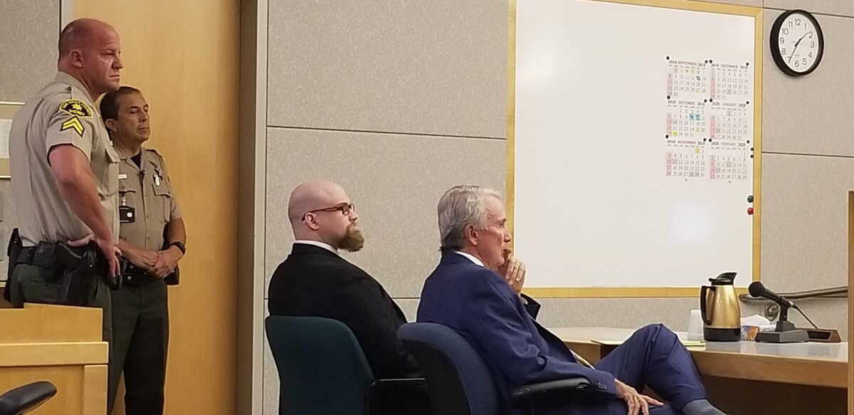 Mikhail Schmidt, seated on the left, listens in court last week as a Superior Court jury finds him guilty of first-degree murder in the 2017 death of Jacob Bravo. Seated next to him on the right is defense attorney Brad Patton.