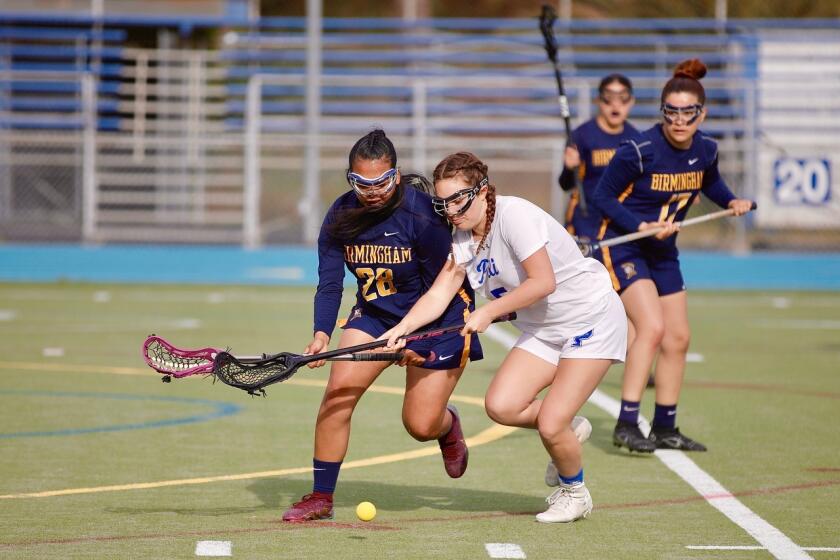 Birmingham's Rachel Franco (left) and Palisades’ Erica Davis try to scoop up a group ball during City title lacrosse match.