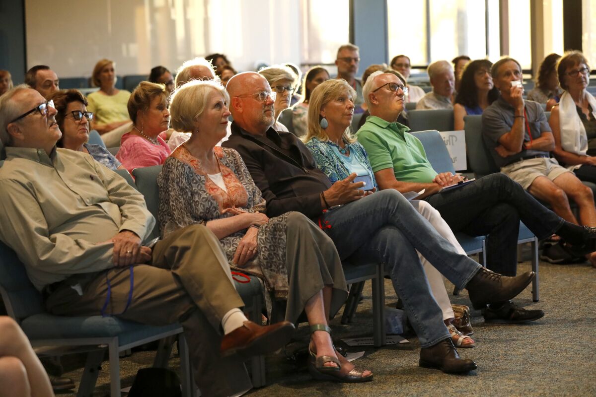 A mostly-white audience at The Unity Center listens to dialogue expert David Campt talk about how to be a "white ally" in the fight against racism.