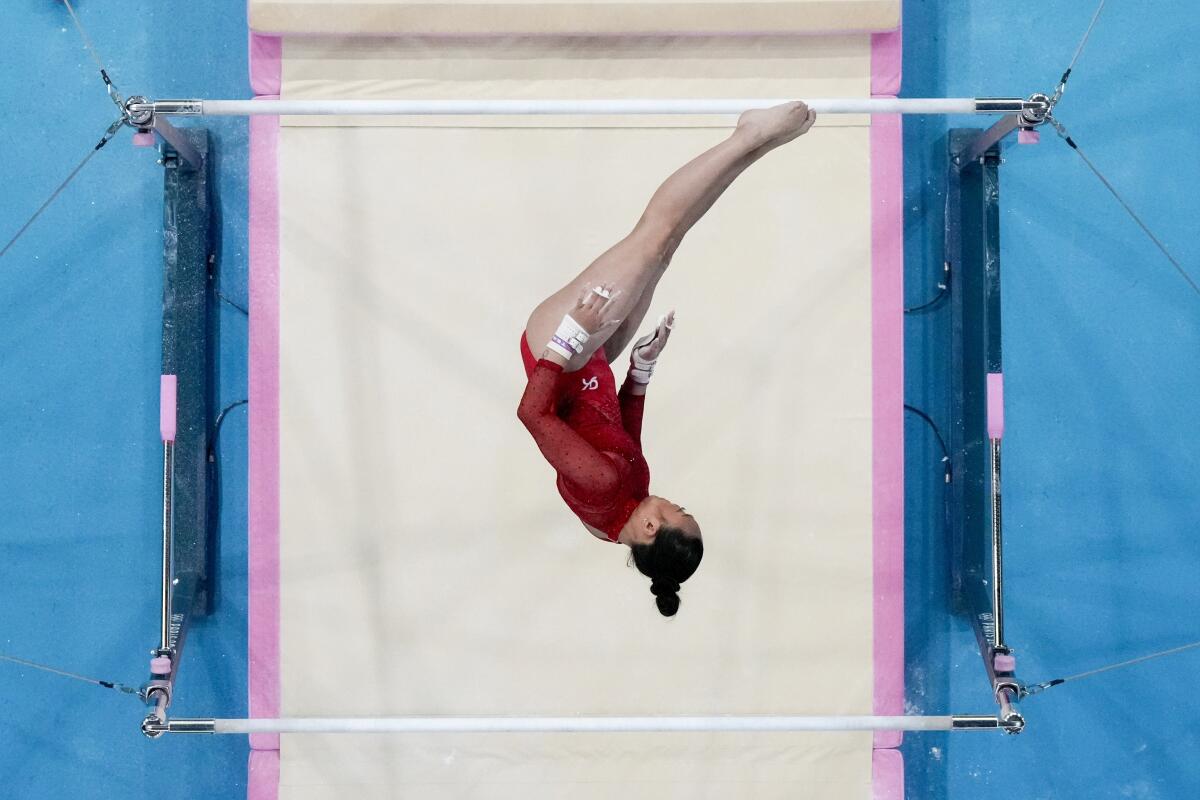Suni Lee performs on the uneven bars at the Paris Olympic Games on Sunday.