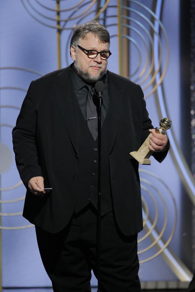 This image released by NBC shows Guillermo del Toro accepting the award for best director for "The Shape of Water," at the 75th Annual Golden Globe Awards in Beverly Hills, Calif., on Sunday, Jan. 7, 2018. (Paul Drinkwater/NBC via AP)