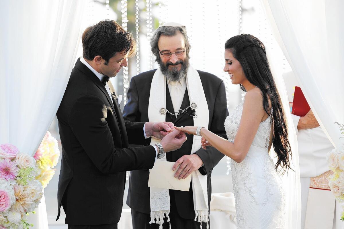 Gabrielle "Ellie" and Zach Slavis of San Clemente were married this month in Huntington Beach by Rabbi Barry Tuchman of Irvine and Bishop Brian P. Delvaux.