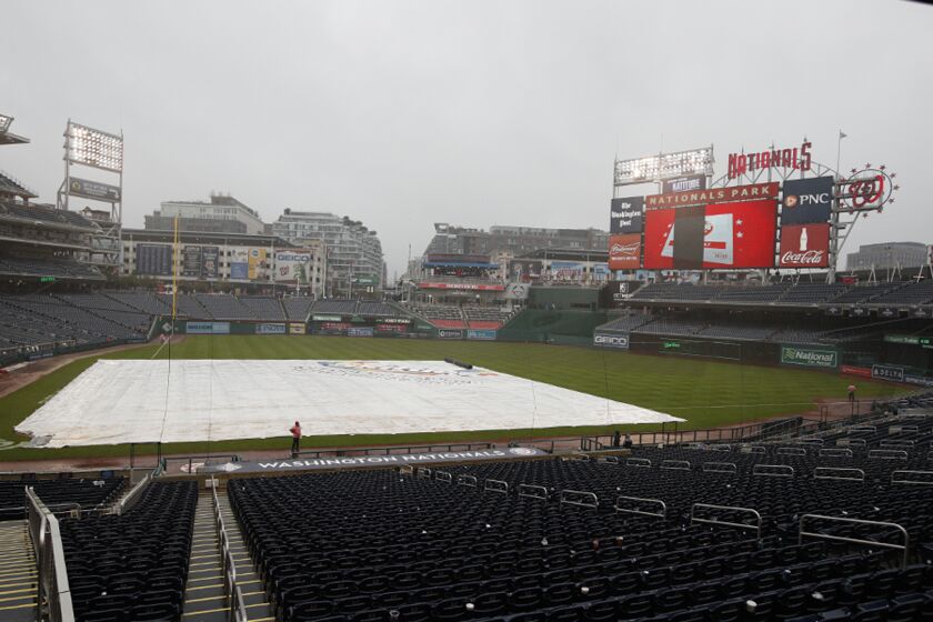 Nationals Park is seen in a rain delay during a baseball game between the Philadelphia Phillies and Washington Nationals, Sunday, Oct. 2, 2022, in Washington. (AP Photo/Luis M. Alvarez)
