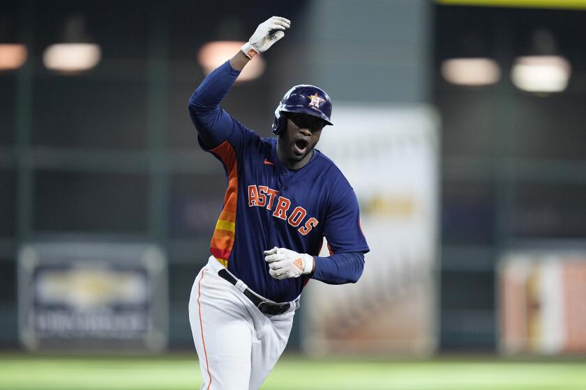 Houston Astros designated hitter Yordan Alvarez celebrates his two-run home run against the Seattle Mariners during the sixth inning in Game 2 of an American League Division Series baseball game in Houston, Thursday, Oct. 13, 2022. (AP Photo/Kevin M. Cox)