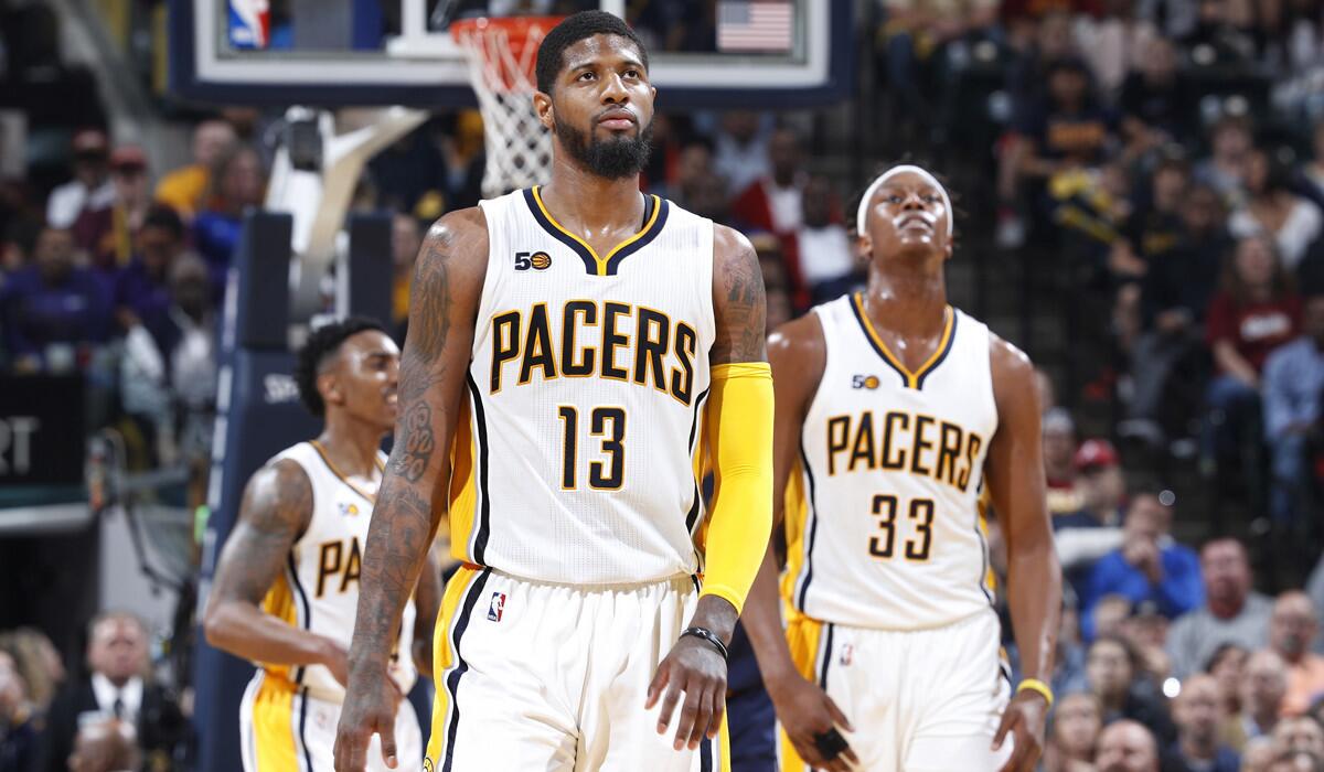 Indiana Pacers Paul George (13) and Myles Turner (33) react in the second half of Game 4 of the NBA Eastern Conference Quarterfinals against the Cleveland Cavaliers on April 23.
