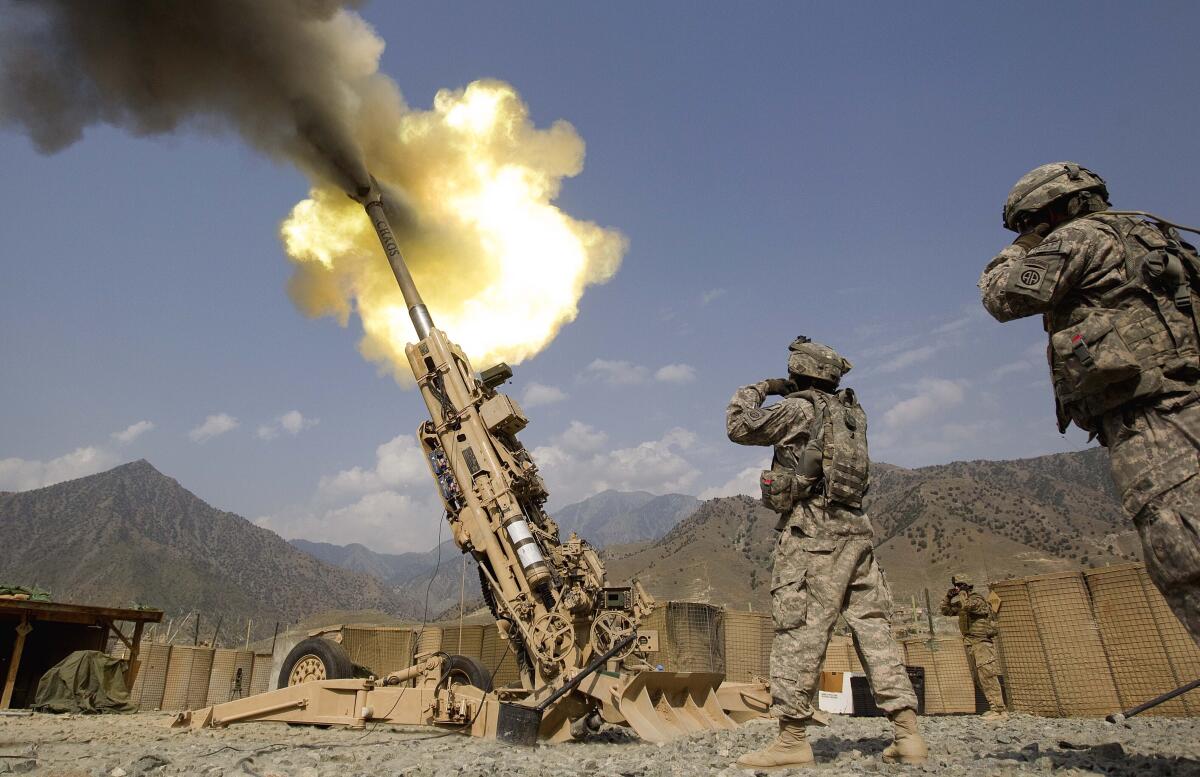 Artillery being fired from a howitzer