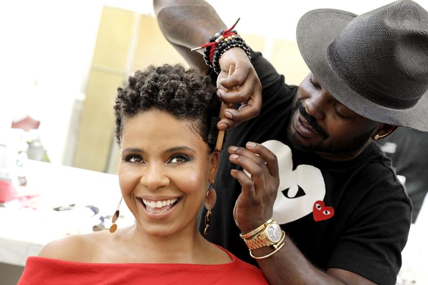 LOS ANGELES, CA., SEPTEMBER 10, 2018 -- Sanaaa Lathan stars is in Nappily Ever After a movie about how a soulful barber helps a woman piece her life back together after an accident at her hair salon makes her realize she is not living life to the fullest. Pictured are Sanaa Lathan and celebrity stylist Larry Sims. (Kirk McKoy / Los Angeles Times)