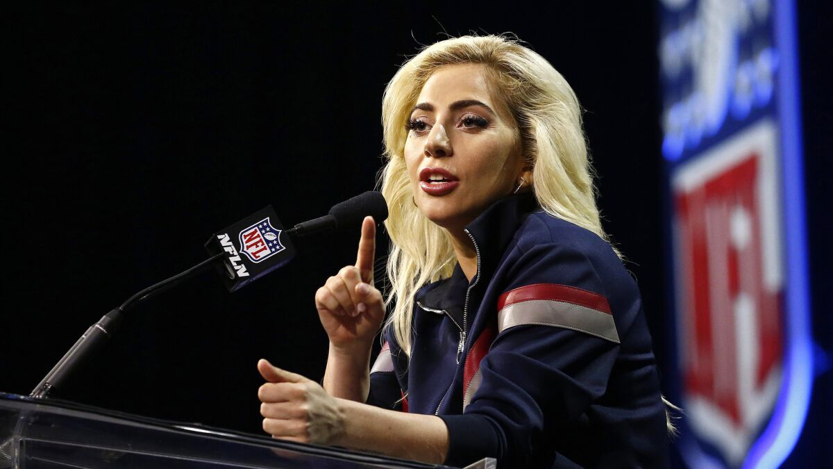 Lady Gaga responds to a question during a Super Bowl halftime show news conference on Thursday in Houston.