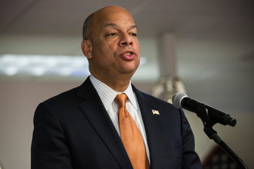 Homeland Security Secretary Jeh Johnson administers the oath of allegiance to new U.S. citizens during a naturalization ceremony last week in New York.